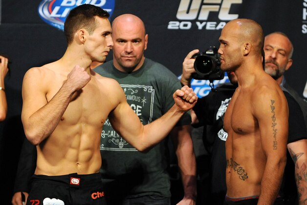Nov 15, 2013; Las Vegas, NV, USA; UFC fighters Rory MacDonald (left) and Robbie Lawler pose for photographs during the weigh-in of UFC 167 at MGM Grand Garden Arena. Mandatory Credit: Stephen R. Sylvanie-USA TODAY Sports