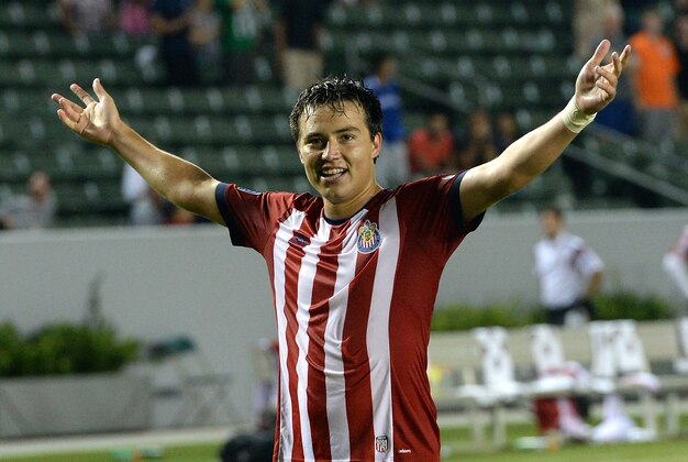 Jul 5, 2014; Carson, CA, USA;  Chivas USA forward Erick Torres (9) raises his arms to the crowd celebrating his goal that won the game in extra time against the Montreal Impact at StubHub Center. Mandatory Credit: Jayne Kamin-Oncea-USA TODAY Sports