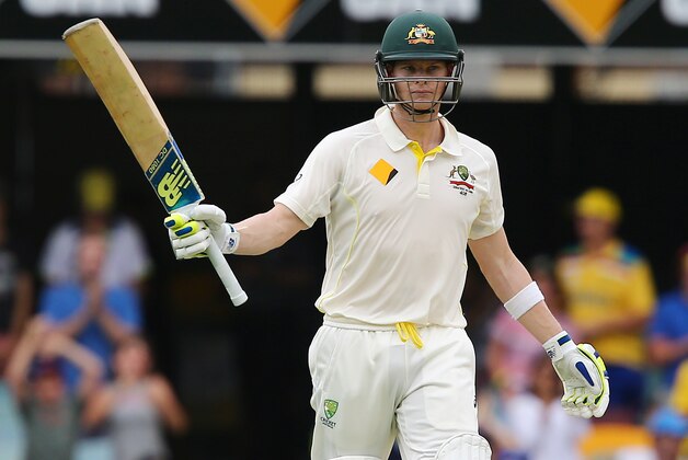 Australian batsman Steven Smith reacts after hitting a half century during play on day two of the second cricket test against India in Brisbane, Australia, Thursday, December 18, 2014. (AP Photo/Tertius Pickard)