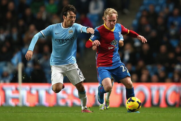MANCHESTER, ENGLAND - DECEMBER 28:  Jonathan Williams of Crystal Palace competes with David Silva of Manchester City during the Barclays Premier League match between Manchester City and Crystal Palace at the Etihad Stadium on December 28, 2013 in Manchester, England.  (Photo by Jan Kruger/Getty Images)
