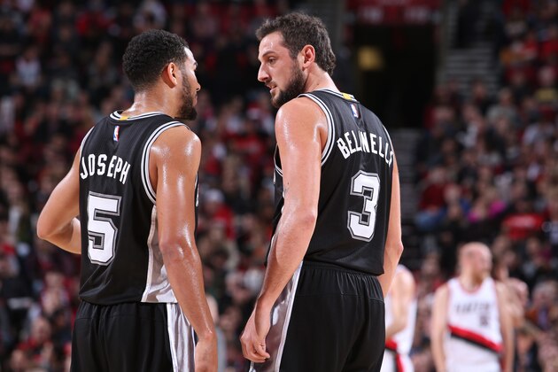 PORTLAND, OR - DECEMBER 15:  Cory Joseph #5 and Marco Belinelli #3 of the San Antonio Spurs talk against the Portland Trail Blazers on December 15, 2014 at the Moda Center Arena in Portland, Oregon. NOTE TO USER: User expressly acknowledges and agrees that, by downloading and or using this photograph, user is consenting to the terms and conditions of the Getty Images License Agreement. Mandatory Copyright Notice: Copyright 2014 NBAE (Photo by Sam Forencich/NBAE via Getty Images)