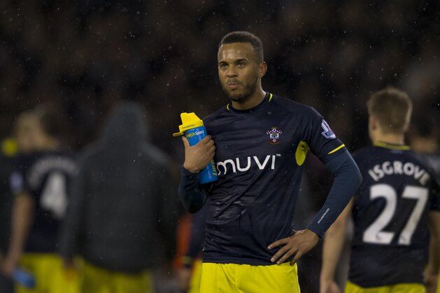 Southampton's Nathaniel Clyne stands in the rain after his team's 1-0 loss in the English League Cup Quarter-Final soccer match between Sheffield United and Southampton at Bramall Lane Stadium, Sheffield, England, Tuesday, Dec. 16, 2014. (AP Photo/Jon Super)