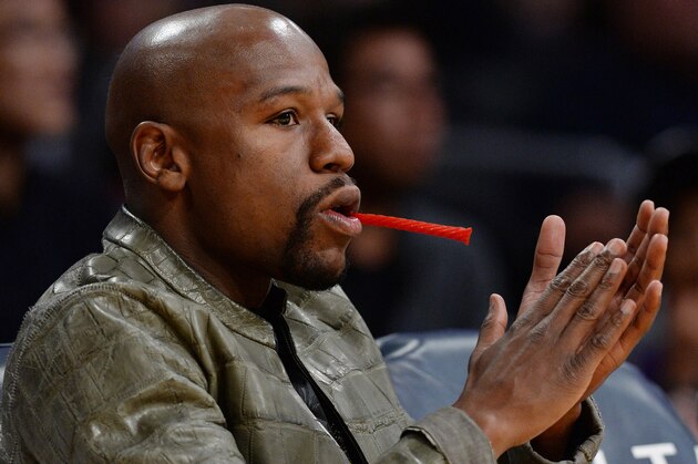 Nov 9, 2014; Los Angeles, CA, USA;  Professional boxer Floyd Mayweather, Jr. watches the game between the Charlotte Hornets and the Los Angeles Lakers at Staples Center. Lakers won 107-92. Mandatory Credit: Jayne Kamin-Oncea-USA TODAY Sports