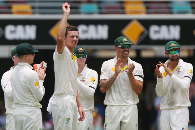 BRISBANE, AUSTRALIA - DECEMBER 18:  Josh Hazlewood  of Australia celebrates with team mates after taking his 5th wicket after dismissing Mahendra Singh Dhoni of India and during day two of the 2nd Test match between Australia and India at The Gabba on December 18, 2014 in Brisbane, Australia.  (Photo by Chris Hyde/Getty Images)