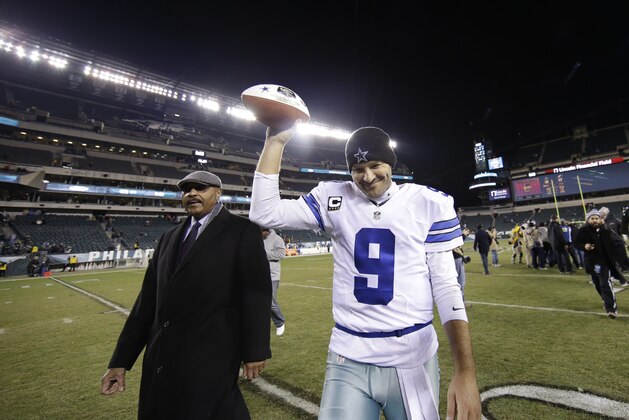 Dallas Cowboys' Tony Romo celebrates after an NFL football game against the Philadelphia Eagles, Sunday, Dec. 14, 2014, in Philadelphia. Dallas won 38-27. (AP Photo/Michael Perez)