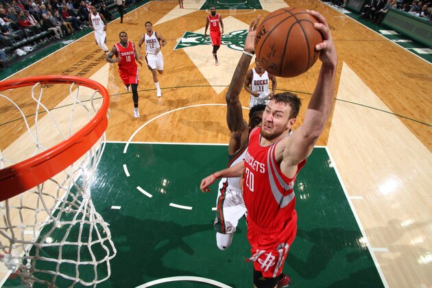 Milwaukee, WI - NOVEMBER 29: Donatas Motiejunas #20 of the Houston Rockets goes up for a dunk against the Milwaukee Bucks during the game on November 29, 2014 at the BMO Harris Bradley Center in Milwaukee, Wisconsin. NOTE TO USER: User expressly acknowledges and agrees that, by downloading and or using this Photograph, user is consenting to the terms and conditions of the Getty Images License Agreement. Mandatory Copyright Notice: Copyright 2014 NBAE (Photo by Gary Dineen/NBAE via Getty Images)