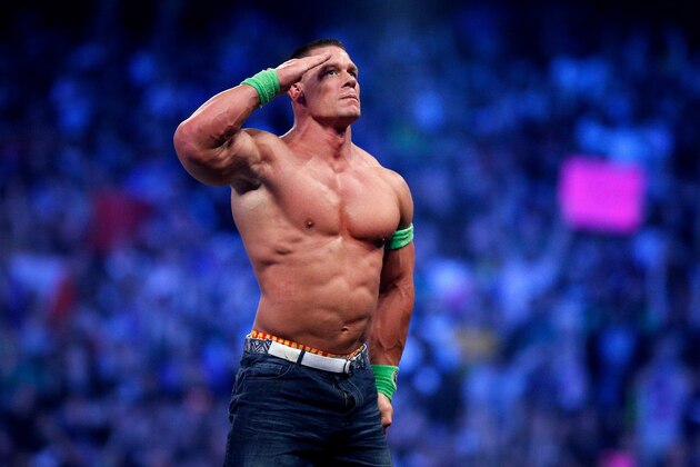 John Cena celebrates his win during Wrestlemania XXX at the Mercedes-Benz Super Dome in New Orleans on Sunday, April 6, 2014. (Jonathan Bachman/AP Images for WWE)