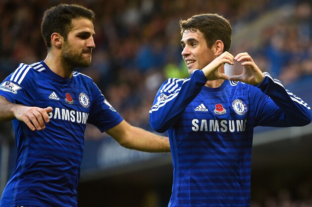 LONDON, ENGLAND - NOVEMBER 01:  Oscar of Chelsea celebrates his goal with Cesc Fabregas during the Barclays Premier League match between Chelsea and Queens Park Rangers at Stamford Bridge on November 1, 2014 in London, England.  (Photo by Mike Hewitt/Getty Images)