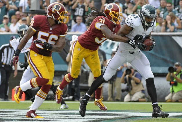 Sep 21, 2014; Philadelphia, PA, USA; Philadelphia Eagles wide receiver Jordan Matthews (81) catches an 11-yard touchdown against Washington Redskins inside linebacker Perry Riley (56) and strong safety Brandon Meriweather (31) late in the second quarter at Lincoln Financial Field. Mandatory Credit: Eric Hartline-USA TODAY Sports