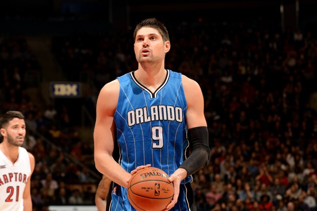 TORONTO, CANADA - December 15: Nikola Vucevic #9 of the Orlando Magic attempts a free throw against the Toronto Raptors on December 15, 2014 at the Air Canada Centre in Toronto, Ontario, Canada.  NOTE TO USER: User expressly acknowledges and agrees that, by downloading and or using this Photograph, user is consenting to the terms and conditions of the Getty Images License Agreement.  Mandatory Copyright Notice: Copyright 2014 NBAE (Photo by Ron Turenne/NBAE via Getty Images)