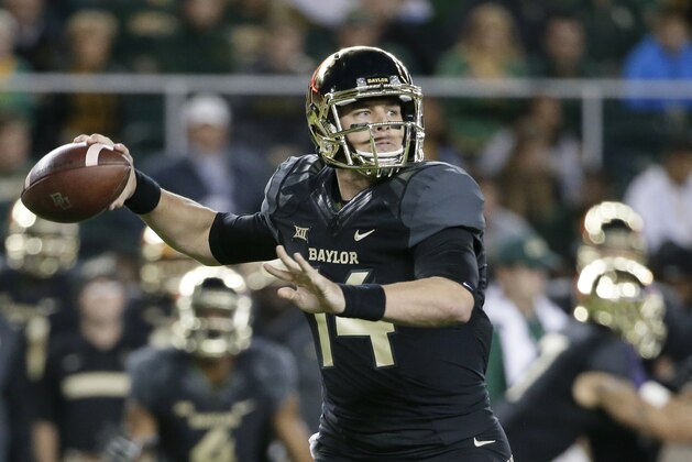 Baylor quarterback Bryce Petty (14) passes in the first half of an NCAA college football game against Kansas State, Saturday, Dec. 6, 2014, in Waco, Texas. (AP Photo/Tony Gutierrez)