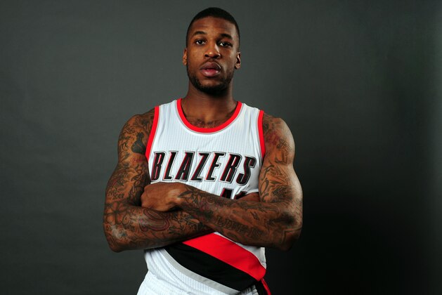 Portland Trail Blazers forward Thomas Robinson (41) poses for a photograph during the NBA basketball team's media day in Portland, Ore., Monday, September 29, 2014. (AP Photo/Steve Dykes)
