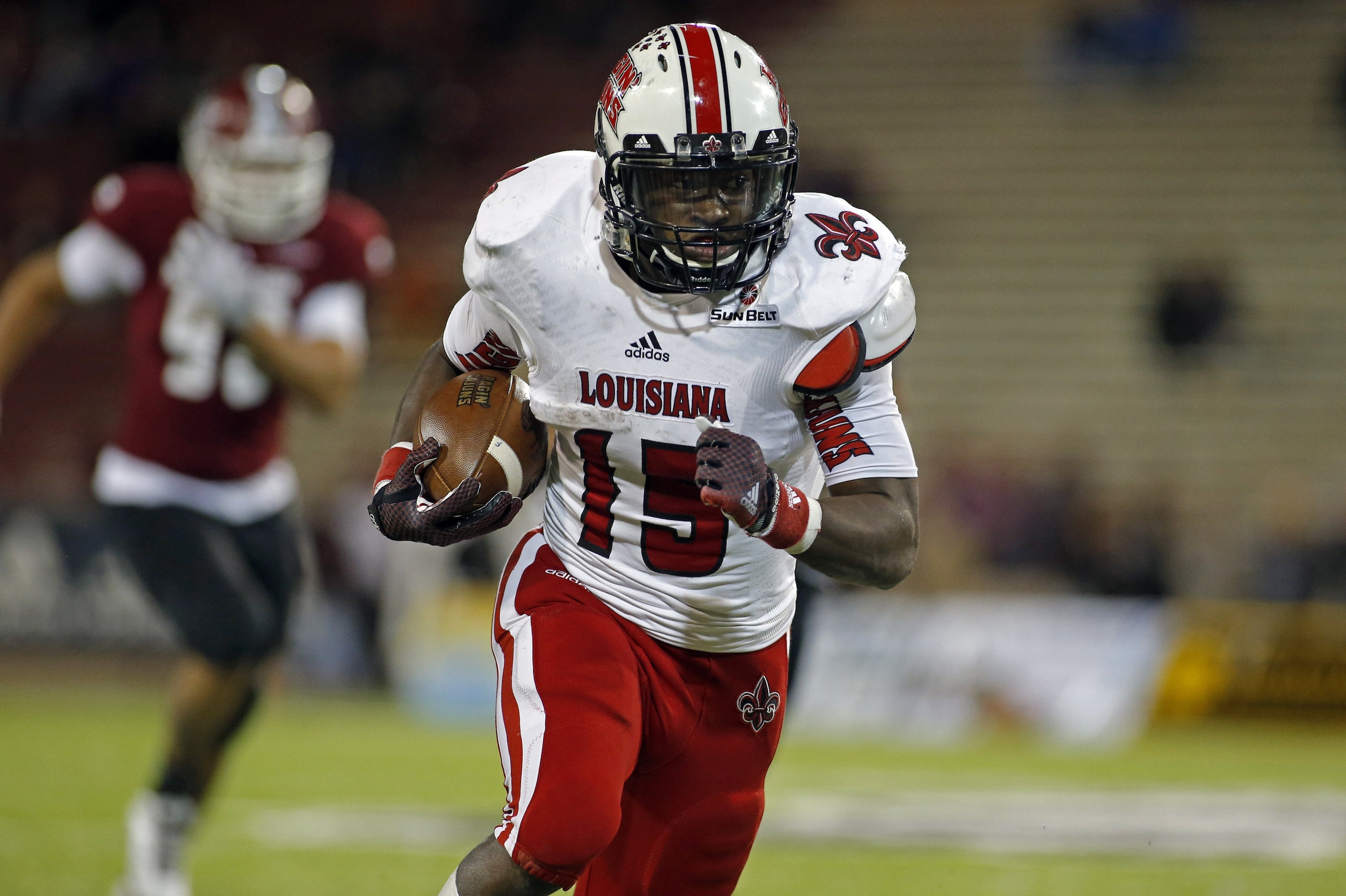 Louisiana-Lafayette running back Elijah McGuire carries during the first half of an NCAA college football game against New Mexico State in Las Cruces, N.M., Saturday, Nov. 8, 2014. Louisiana-Lafayette won 44-16. (AP Photo/Andres Leighton)
