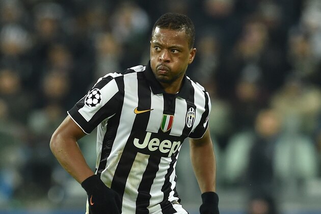 TURIN, ITALY - DECEMBER 09:  Patrice Evra of Juventus in action during the UEFA Champions League group A match between Juventus and Club Atletico de Madrid at Juventus Arena on December 9, 2014 in Turin, Italy.  (Photo by Valerio Pennicino/Getty Images)