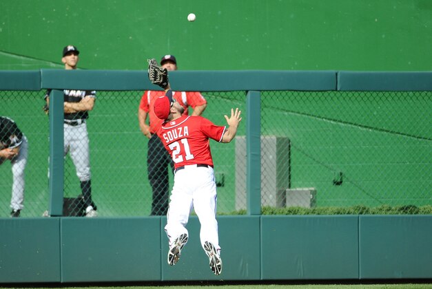Sep 28, 2014; Washington, DC, USA; Washington Nationals left fielder Steven Souza (21) makes a diving catch for the final out of the game against the Miami Marlins to secure Washington Nationals starting pitcher Jordan Zimmermann (27) no hitter at Nationals Park. Mandatory Credit: Brad Mills-USA TODAY Sports