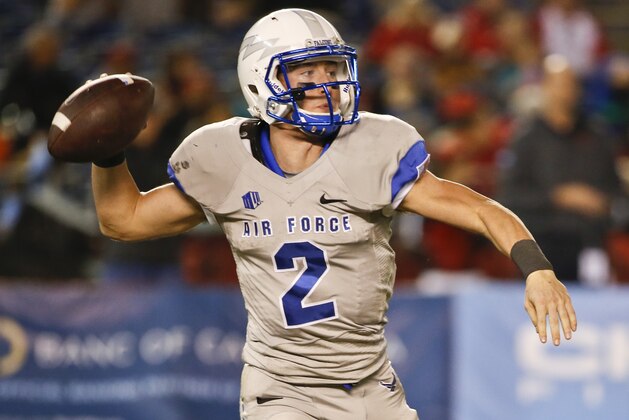 Air Force quarterback Kale Pearson throws a pass against San Diego State during the second half of an NCAA college football game won 30-14 by San Diego Friday, Nov. 21, 2014, in San Diego. (AP Photo/Lenny Ignelzi)