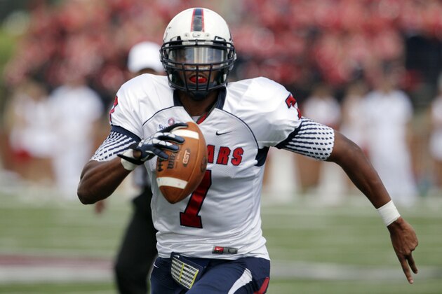 South Alabama quarterback Brandon Bridge (7) looks for yardage against Troy during an NCAA college football game in Troy, Ala., Saturday, Oct. 5, 2013. (AP Photo/Jay Sailors)