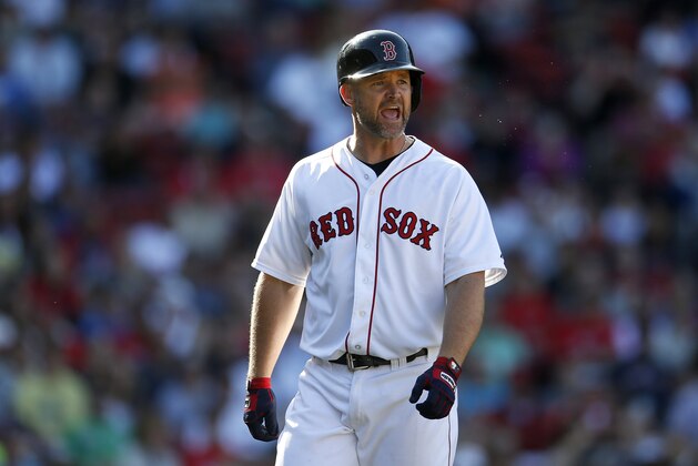 Boston Red Sox's David Ross reacts after he struck out swinging during the eighth inning of a baseball game against the Seattle Mariners in Boston, Saturday, Aug. 23, 2014. Ross was then ejected by first base umpire Vic Carapazza. (AP Photo/Michael Dwyer)