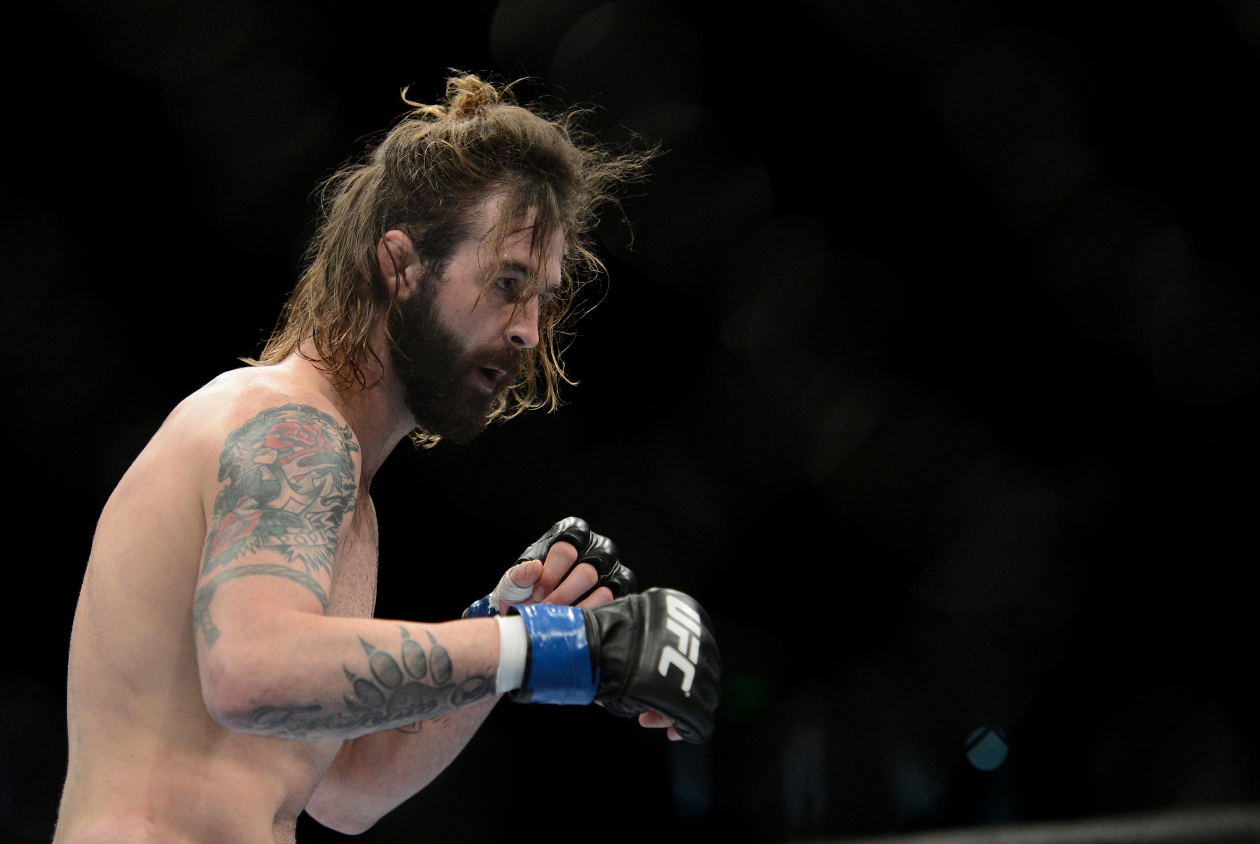 December 14, 2013; Sacramento, CA, USA; Cody McKenzie (blue gloves) fights Sam Stout (red gloves) during the lightweight bout of the UFC on FOX 9 at Sleep Train Arena. Mandatory Credit: Kyle Terada-USA TODAY Sports