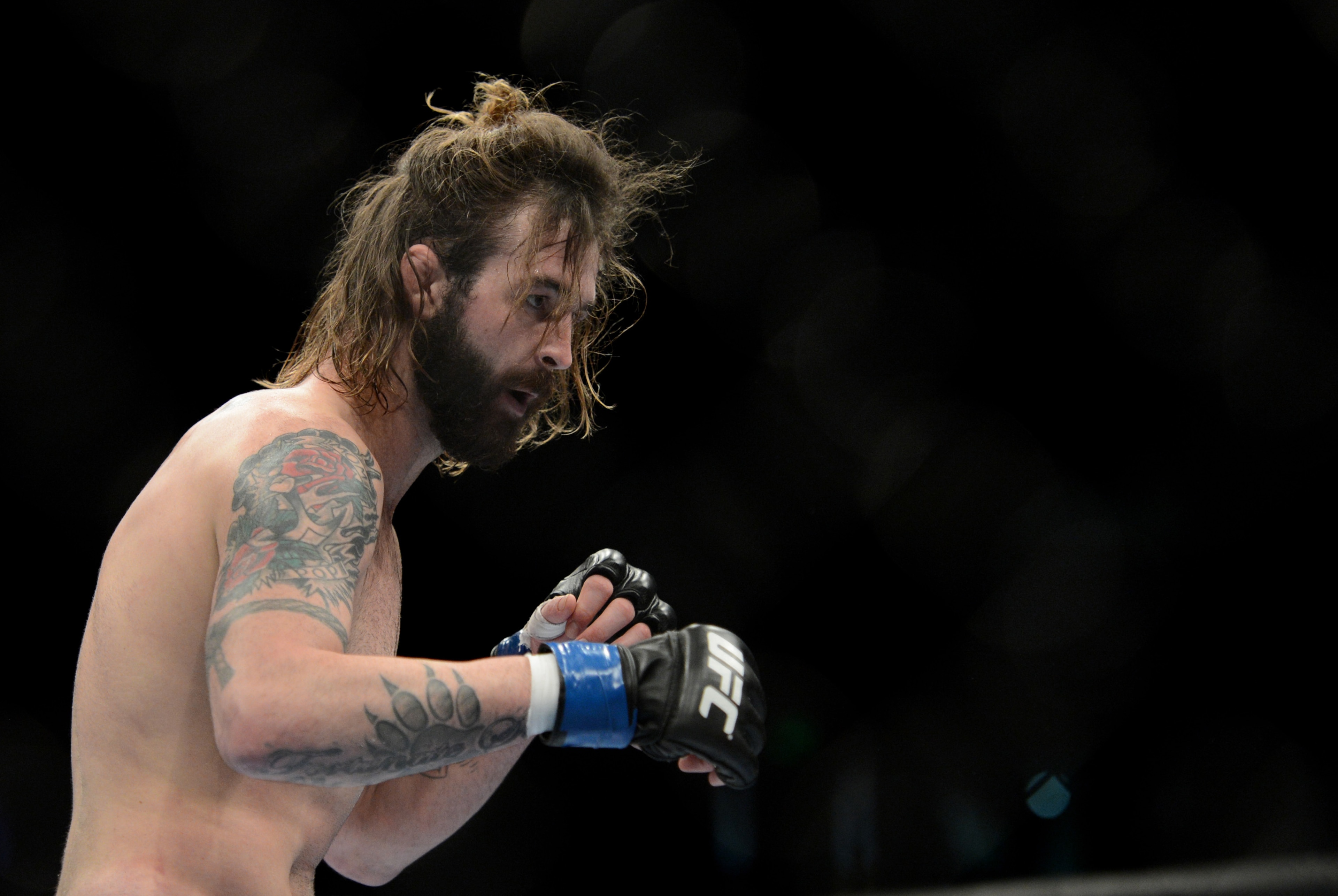 December 14, 2013; Sacramento, CA, USA; Cody McKenzie (blue gloves) fights Sam Stout (red gloves) during the lightweight bout of the UFC on FOX 9 at Sleep Train Arena. Mandatory Credit: Kyle Terada-USA TODAY Sports December 14, 2013; Sacramento, CA, USA; Cody McKenzie (blue gloves) fights Sam Stout (red gloves) during the lightweight bout of the UFC on FOX 9 at Sleep Train Arena. Mandatory Credit: Kyle Terada-USA TODAY Sports