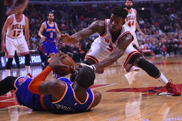 Dec 18, 2014; Chicago, IL, USA; New York Knicks forward Amar'e Stoudemire (1) and Chicago Bulls guard Jimmy Butler (21) attempt to get a loose ball during the first quarter at United Center. Mandatory Credit: Mike DiNovo-USA TODAY Sports