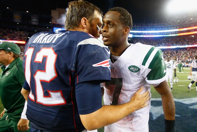FOXBORO, MA - OCTOBER 16:  Geno Smith #7 of the New York Jets hugs Tom Brady #12 of the New England Patriots after a game at Gillette Stadium on October 16, 2014 in Foxboro, Massachusetts.  (Photo by Jared Wickerham/Getty Images)
