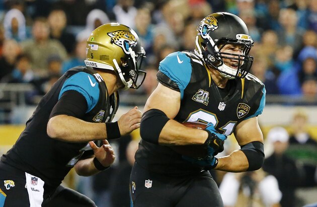JACKSONVILLE, FL - DECEMBER 18:   Blake Bortles #5 hands off to  Toby Gerhart #21 of the Jacksonville Jaguars in the second quarter against the Tennessee Titans at EverBank Field on December 18, 2014 in Jacksonville, Florida.  (Photo by Sam Greenwood/Getty Images)