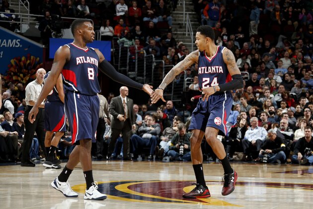 CLEVELAND, OH - DECEMBER 17: Shelvin Mack #8 and Kent Bazemore #24 of the Atlanta Hawks celebrate during a game against the Cleveland Cavaliers at The Quicken Loans Arena on December 17, 2014 in Cleveland, Ohio. NOTE TO USER: User expressly acknowledges and agrees that, by downloading and/or using this Photograph, user is consenting to the terms and conditions of the Getty Images License Agreement. Mandatory Copyright Notice: Copyright 2014 NBAE (Photo by Gregory Shamus/NBAE via Getty Images)