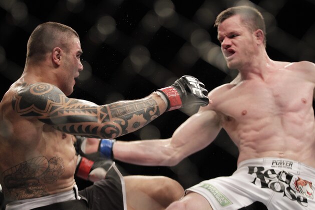 Daniel Serafian, from Brazil, left,  fights C.B. Dollaway, from the U.S. during their middleweight mixed martial arts bout at the Ultimate Fighting Championship (UFC) in Sao Paulo, Brazil, Sunday, Jan. 20, 2013. (AP Photo/Andre Penner)