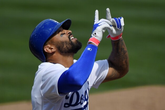 Los Angeles Dodgers' Matt Kemp gestures after hitting a solo home run during the first inning of a baseball game against the Colorado Rockies, Sunday, Sept. 28, 2014, in Los Angeles.   (AP Photo/Mark J. Terrill)