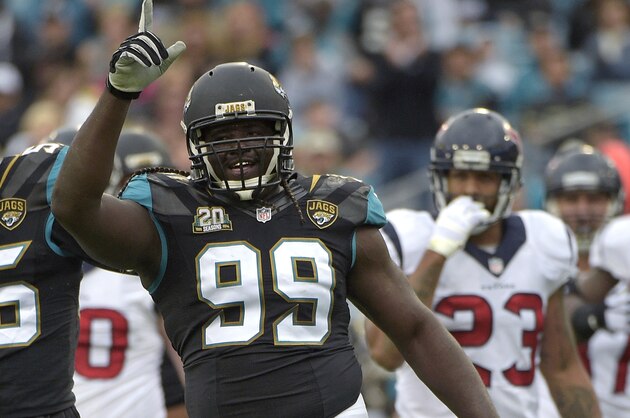 Jacksonville Jaguars defensive tackle Sen'Derrick Marks (99) celebrates after recording a sack during the first half of an NFL football game against the Houston Texans in Jacksonville, Fla., Sunday, Dec. 7, 2014.(AP Photo/Phelan M. Ebenhack)
