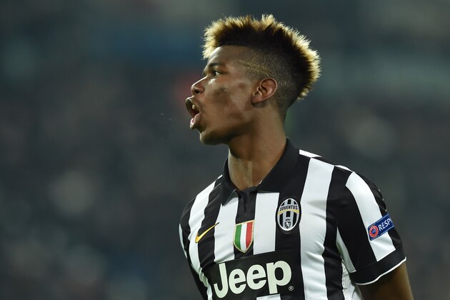 TURIN, ITALY - DECEMBER 09:  Paul Pogba of Juventus reacts during the UEFA Champions League group A match between Juventus and Club Atletico de Madrid at Juventus Arena on December 9, 2014 in Turin, Italy.  (Photo by Valerio Pennicino/Getty Images)