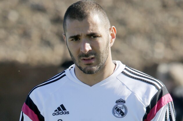 Real Madrid's Karim Benzema attends a training session at the Club World Cup soccer tournament in Marrakech, Morocco, Thursday, Dec. 18, 2014. Real Madrid will play against San Lorenzo during their final game in Marrakech on Saturday , Dec. 20. (AP Photo/Abdeljalil Bounhar)