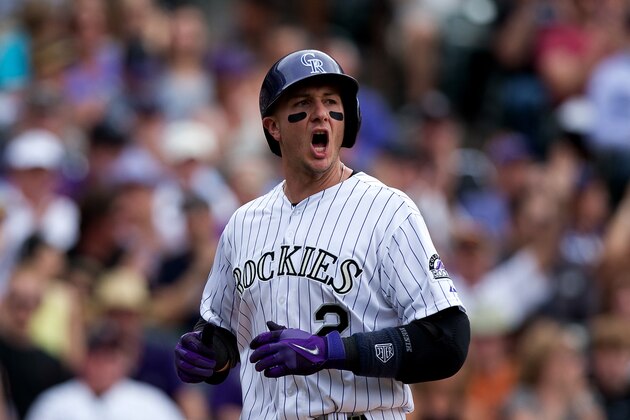 DENVER, CO - MAY 18:  Troy Tulowitzki #2 of the Colorado Rockies celebrates after scoring on a single by Carlos Gonzalez (not pictured) during the seventh inning against the San Diego Padres at Coors Field on May 18, 2014 in Denver, Colorado. The Rockies defeated the Padres 8-6 in 10 innings. (Photo by Justin Edmonds/Getty Images)