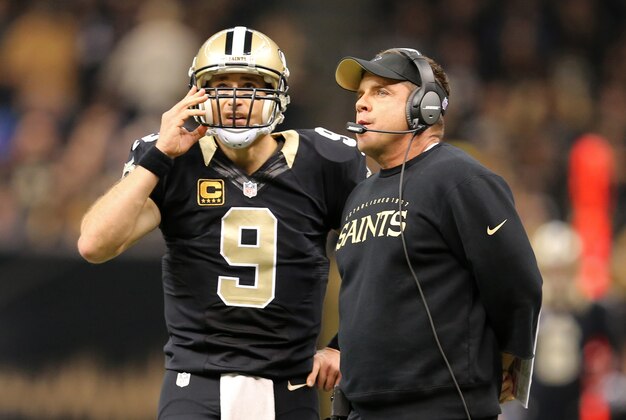 Nov 24, 2014; New Orleans, LA, USA; New Orleans Saints quarterback Drew Brees (9) talks to head coach Sean Payton in the first quarter of their game against the Baltimore Ravens at the Mercedes-Benz Superdome. Mandatory Credit: Chuck Cook-USA TODAY Sports