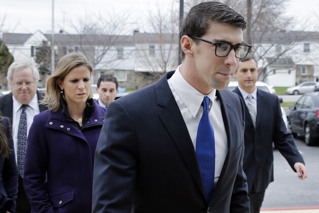 Olympic swimmer Michael Phelps walks into a courthouse for a trial on drunken driving and other charges, Friday, Dec. 19, 2014, in Baltimore. Documents show that the 29-year-old was leaving Baltimore's Horseshoe Casino Sept. 30 when he was pulled over for speeding and crossing the double yellow line on a highway. Police say Phelps registered a .14 per cent on a blood-alcohol test. The legal limit to drive is .08 per cent in Maryland. (AP Photo/Patrick Semansky)