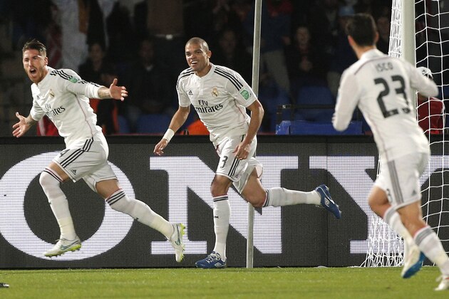 Real Madrid’s Sergio Ramos, left, celebrates his opening goal during the semi final soccer match between Real Madrid and Cruz Azul at the Club World Cup soccer tournament in Marrakech, Morocco, Tuesday, Dec. 16, 2014. (AP Photo/Christophe Ena)