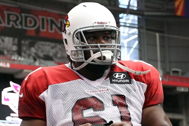 GLENDALE, AZ - JULY 29:  Quard Jonathan Cooper #61 of the Arizona Cardinals practices during the team training camp at University of Phoenix Stadium on July 29, 2013 in Glendale, Arizona.  (Photo by Christian Petersen/Getty Images)