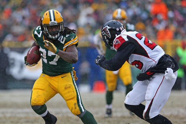 GREEN BAY, WI - DECEMBER 08:  ddie Lacy #27 of the Green Bay Packers avoids William Moore #25 of the Atlanta Falcons at Lambeau Field on December 8, 2013 in Green Bay, Wisconsin. The Packers defeated the Falcons 22-21.  (Photo by Jonathan Daniel/Getty Images)