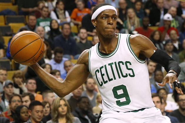 Boston Celtics' Rajon Rondo passes against the New York Knicks during the second half of the New York Knicks 101-95 win in an NBA basketball game in Boston Friday, Dec. 12, 2014. (AP Photo/Winslow Townson)