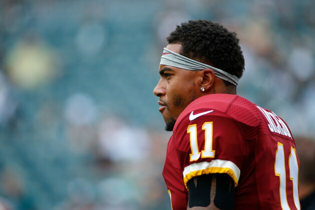 Washington Redskins' DeSean Jackson watches warm ups before an NFL football game against the Philadelphia Eagles, Sunday, Sept. 21, 2014, in Philadelphia. (AP Photo/Matt Rourke)