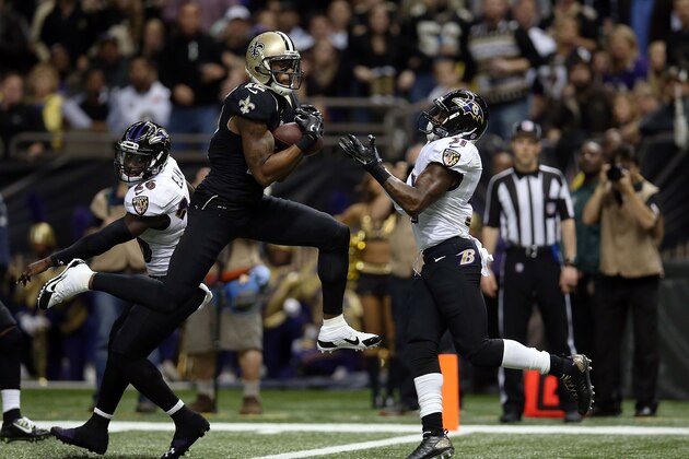 NEW ORLEANS, LA - NOVEMBER 24:  Marques Colston #12 of the New Orleans Saints catches a touchdown pass in front of Terrence Brooks #31 of the Baltimore Ravens during the second quarter of a game at the Mercedes-Benz Superdome on November 24, 2014 in New Orleans, Louisiana.  (Photo by Chris Graythen/Getty Images)