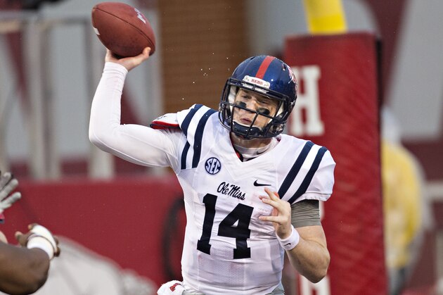 FAYETTEVILLE, AR - NOVEMBER 22:  Bo Wallace #14 of the Ole Miss Rebels throws a pass from the end zone during a game against the Arkansas Razorbacks in second quarter at Razorback Stadium on November 22, 2014 in Fayetteville, Arkansas.  (Photo by Wesley Hitt/Getty Images)