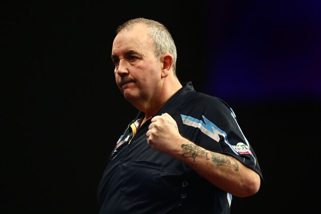 LONDON, ENGLAND - DECEMBER 19:  Phil Taylor of England celebrates winning his first round match against Jyhan Artut of Germany on Day Two of the William Hill PDC World Darts Championships at Alexandra Palace on December 19, 2014 in London, England.  (Photo by Jordan Mansfield/Getty Images)