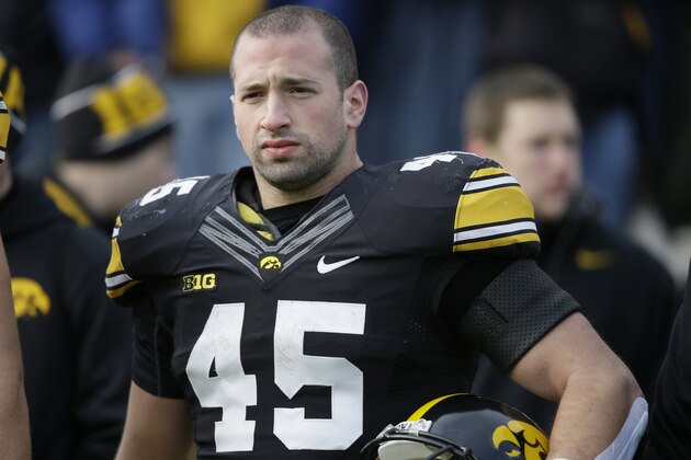 Iowa running back Mark Weisman stands on the sidelines before an NCAA college football game against Nebraska, Friday, Nov. 28, 2014, in Iowa City, Iowa. (AP Photo/Charlie Neibergall)
