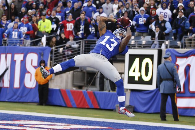 New York Giants wide receiver Odell Beckham (13) comes down with a pass in the end zone against the Washington Redskins during the fourth quarter of an NFL football game, Sunday, Dec. 14, 2014, in East Rutherford, N.J. A flag was called on the play and the catch was not ruled a touchdown. (AP Photo/Julio Cortez)