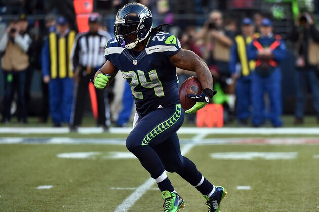 SEATTLE, WA - DECEMBER 14: Running back Marshawn Lynch #24 of the Seattle Seahawks runs with the ball the first quarter of the game against the San Francisco 49ers at CenturyLink Field on December 14, 2014 in Seattle, Washington.  (Photo by Steve Dykes/Getty Images)