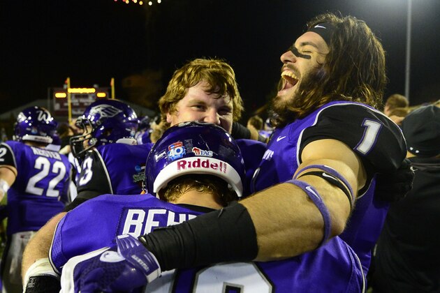 Dec 20, 2013; Salem, VA, USA; UW-Whitewater quarterback Matt Behrendt (16) and offensive linesman Pat Suffield (73) and wide receiver Jake Kumerow (1) react after the game. UW-Whitewater defeated Mount Union Purple Raiders 52-14 at Salem Stadium. Mandatory Credit: Bob Donnan-USA TODAY Sports