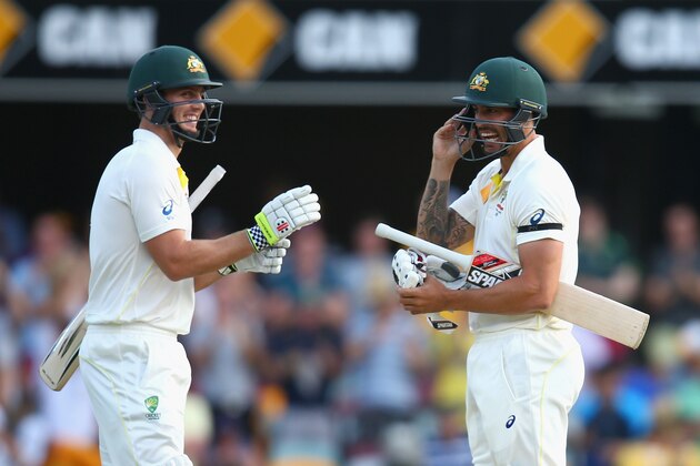 BRISBANE, AUSTRALIA - DECEMBER 20:  Mitch Marsh of Australia and Mitchell Johnson of Australia embrace as Marsh hits the winning runs to win the test during day four of the 2nd Test match between Australia and India at The Gabba on December 20, 2014 in Brisbane, Australia.  (Photo by Cameron Spencer/Getty Images)