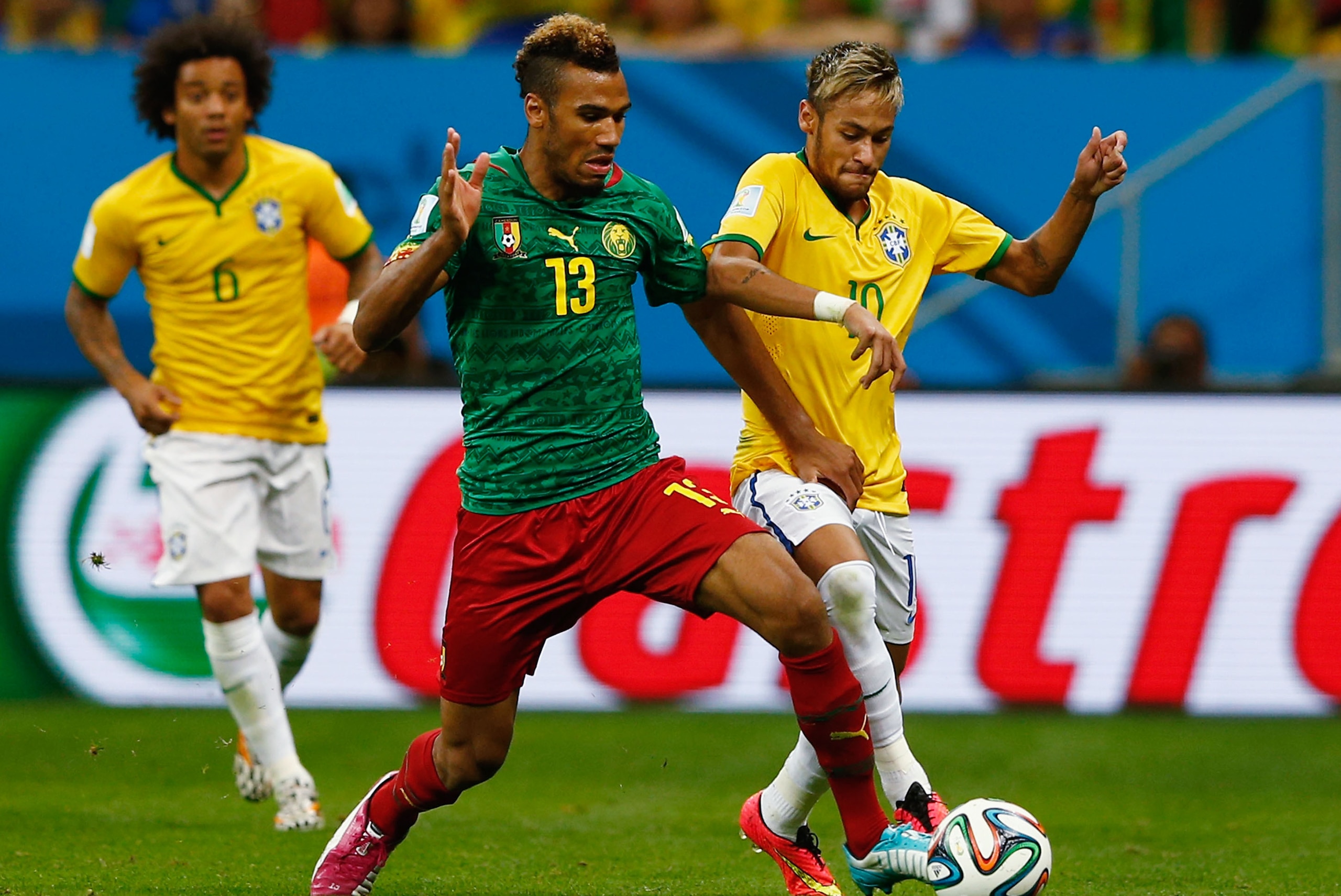 BRASILIA, BRAZIL - JUNE 23:  Maxim Choupo-Moting of Cameroon battles with Neymar of Brazil during the 2014 FIFA World Cup Brazil Group A match between Cameroon and Brazil at Estadio Nacional on June 23, 2014 in Brasilia, Brazil.  (Photo by Matthew Lewis/Getty Images)